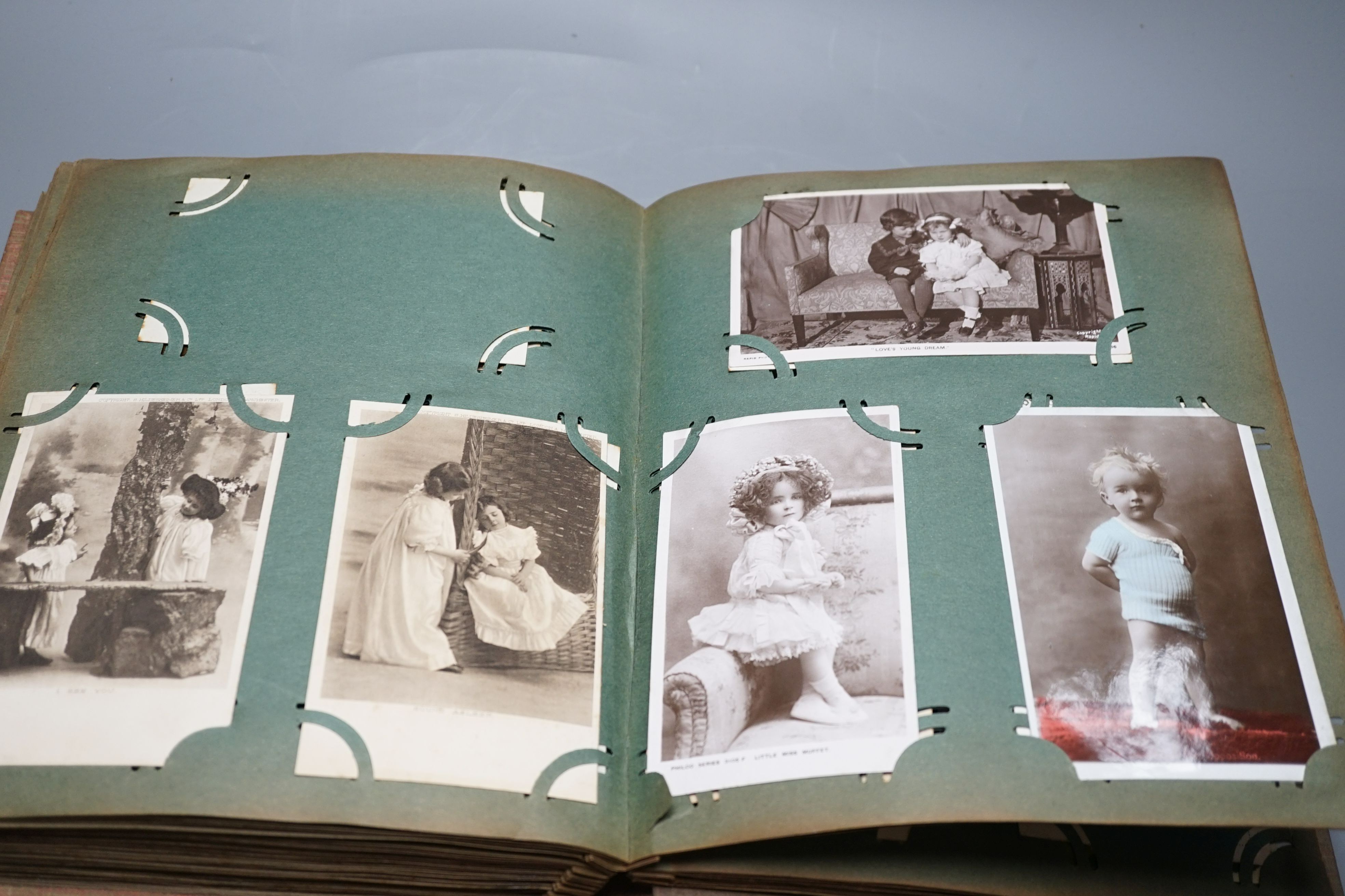 Three postcard albums and contents
